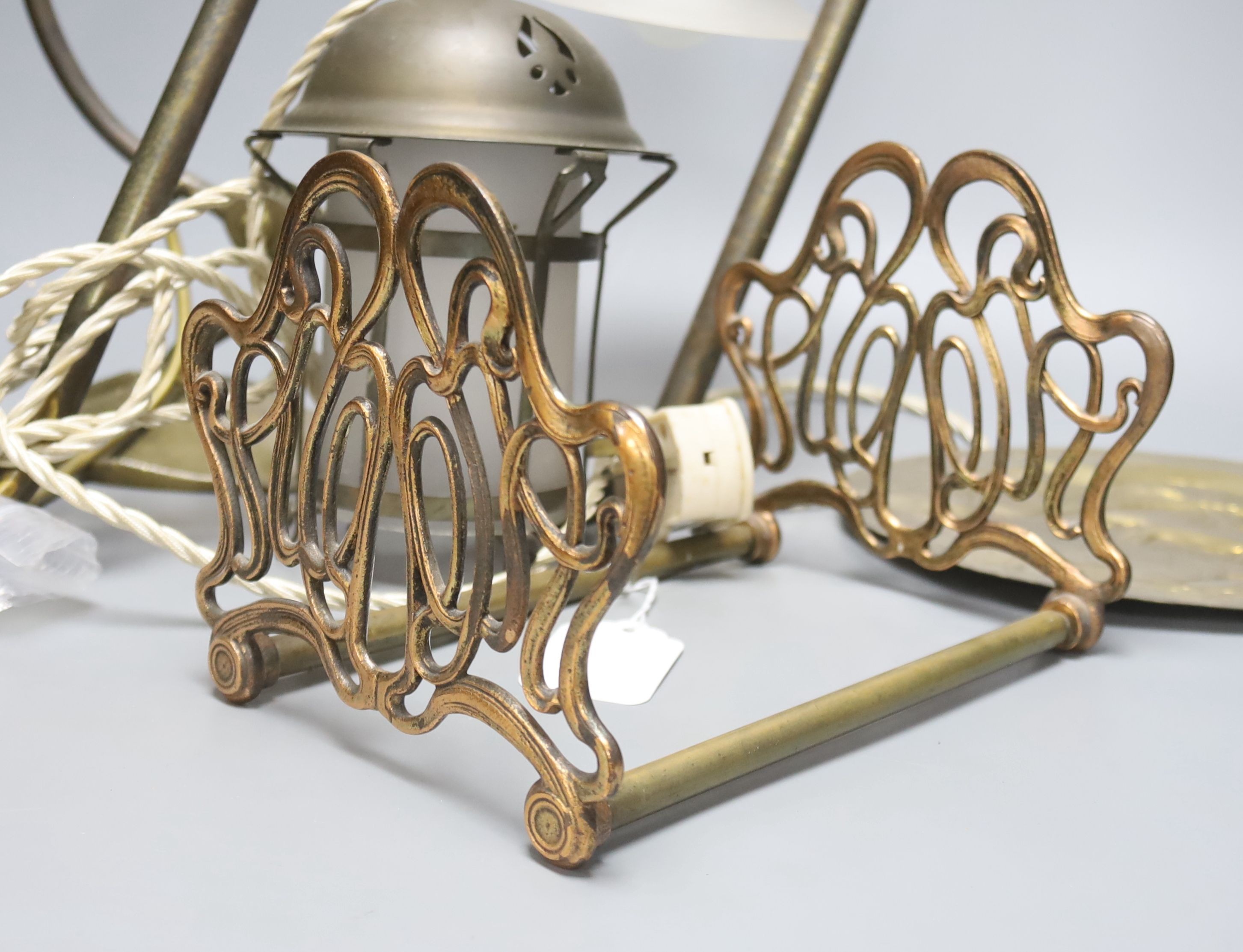 An Art Nouveau brass lamp and telescopic book rack and Arts & Crafts lamp etc